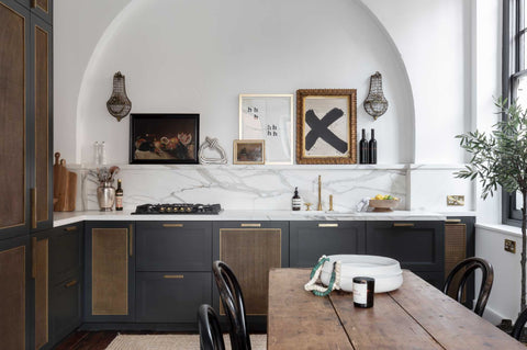 kitchen with brass accents and white arch