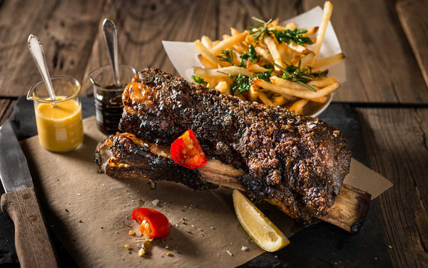 leg of roast lamb served with skinny fries 