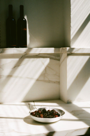 gold calcutta marble with shelf 