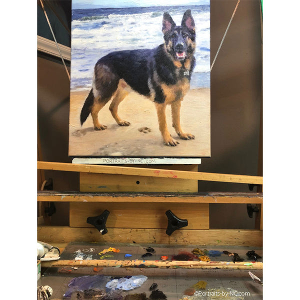 German Shepherd painting on easel