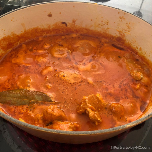 cooking indian buttered chicken