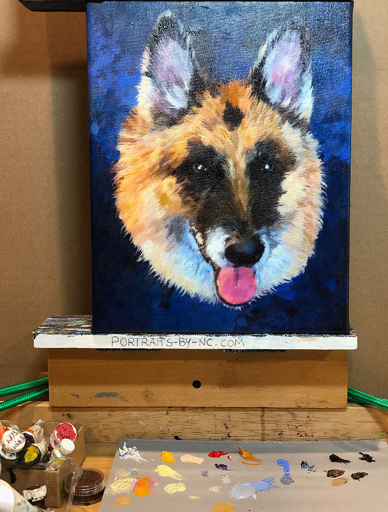 German Shepherd painting on easel