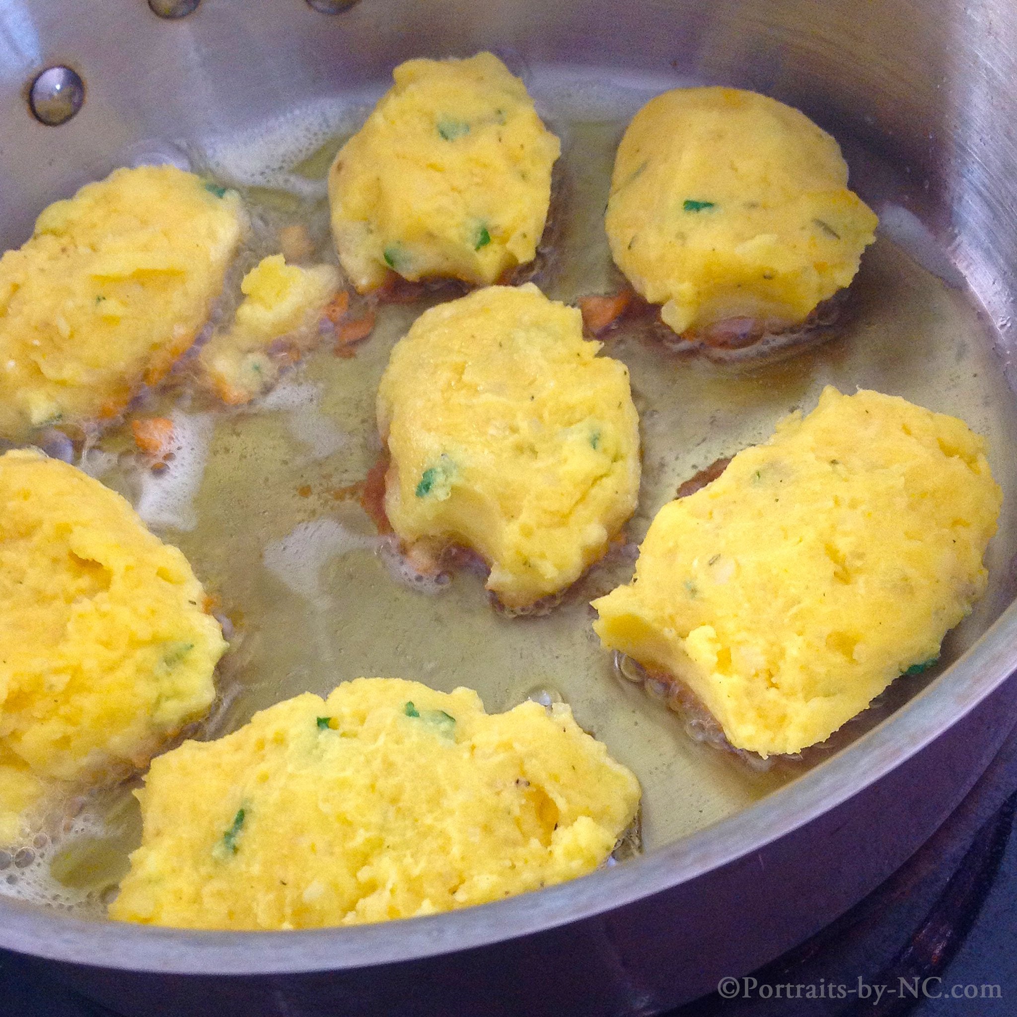 shaped potato patties in pan