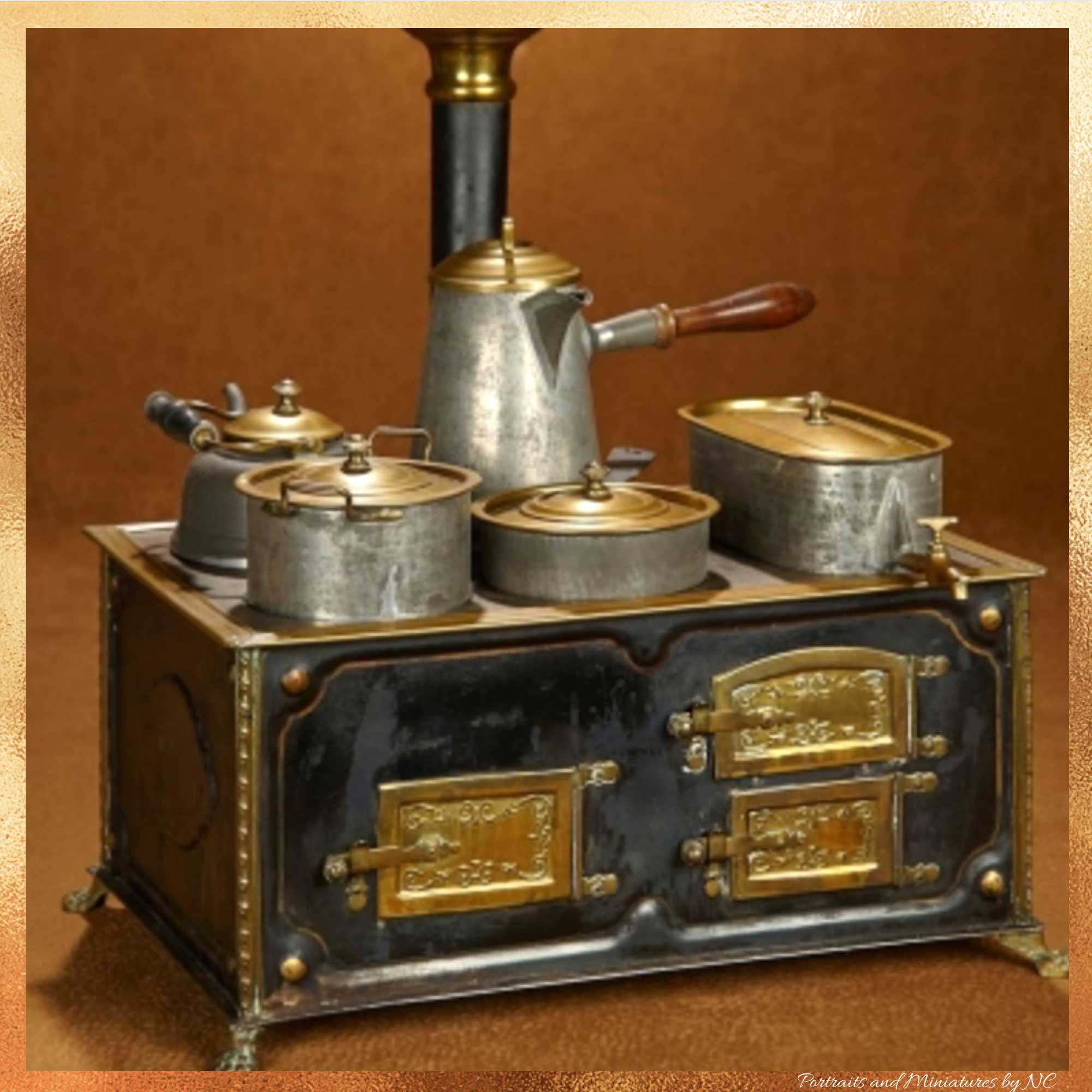 GERMAN TINPLATE TOY STOVE WITH BRASS DOORS AND TRIM