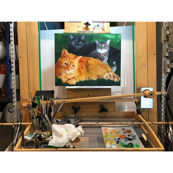 Cat painting on easel 684