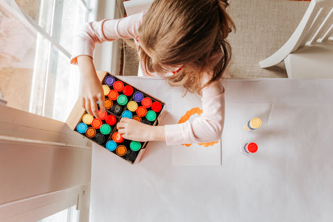 Child organizing dot markers