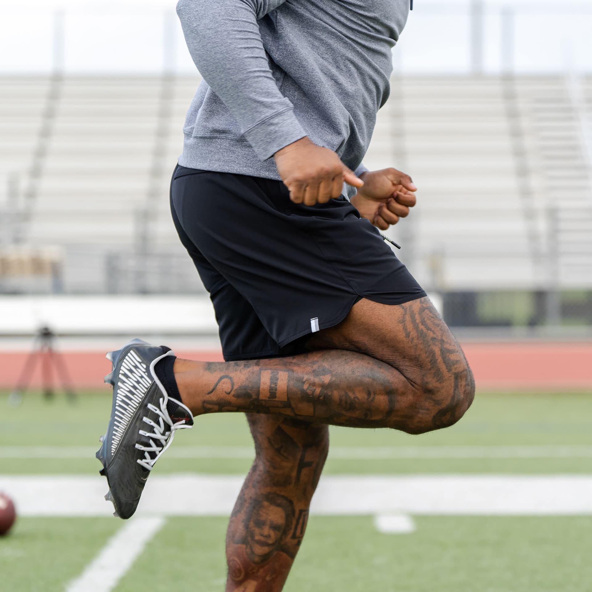 Football player running wearing The Spikes Gym Shorts