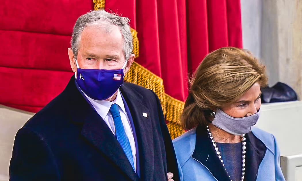 George W. Bush enter the stage wearing the Old Glory Mask.