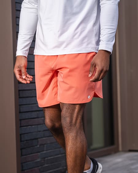 Man walking on the street wearing The Turbos Gym Shorts