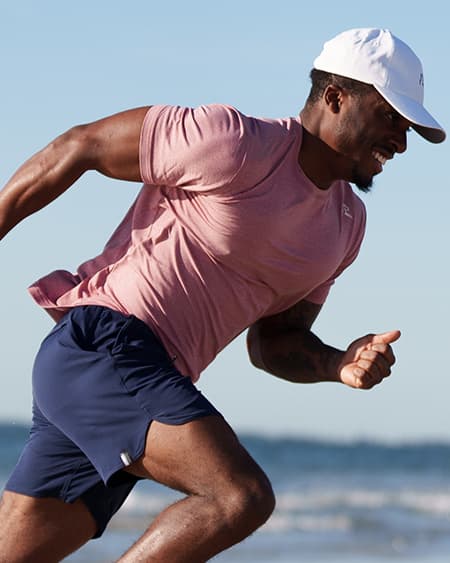 Man running wearing the Blitz Tech Tee - Heather - Red Card Red