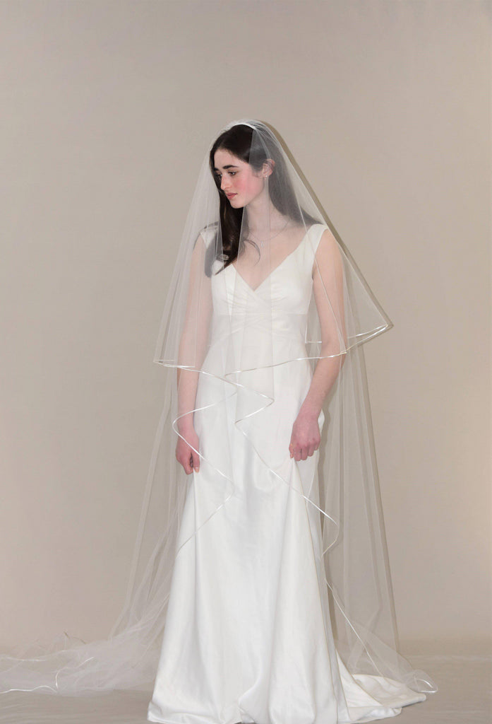 https://cdn.shopify.com/s/files/1/1367/2565/products/Two-Tier-Cathedral-Veil-with-18-Satin-Cord-Edge_e33698de-12b5-4665-9512-a97616604c3d_1024x1024.jpg?v=1658934163