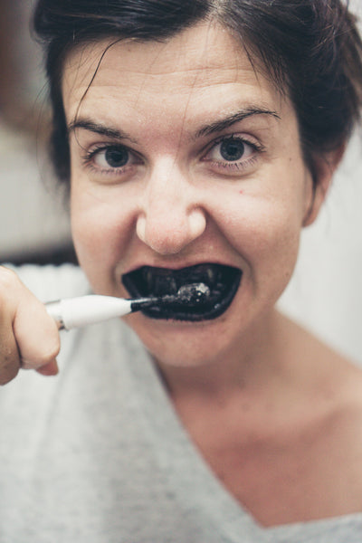 Activated charcoal teeth whitening