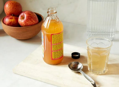 bottle of apple cider vinegar on a table