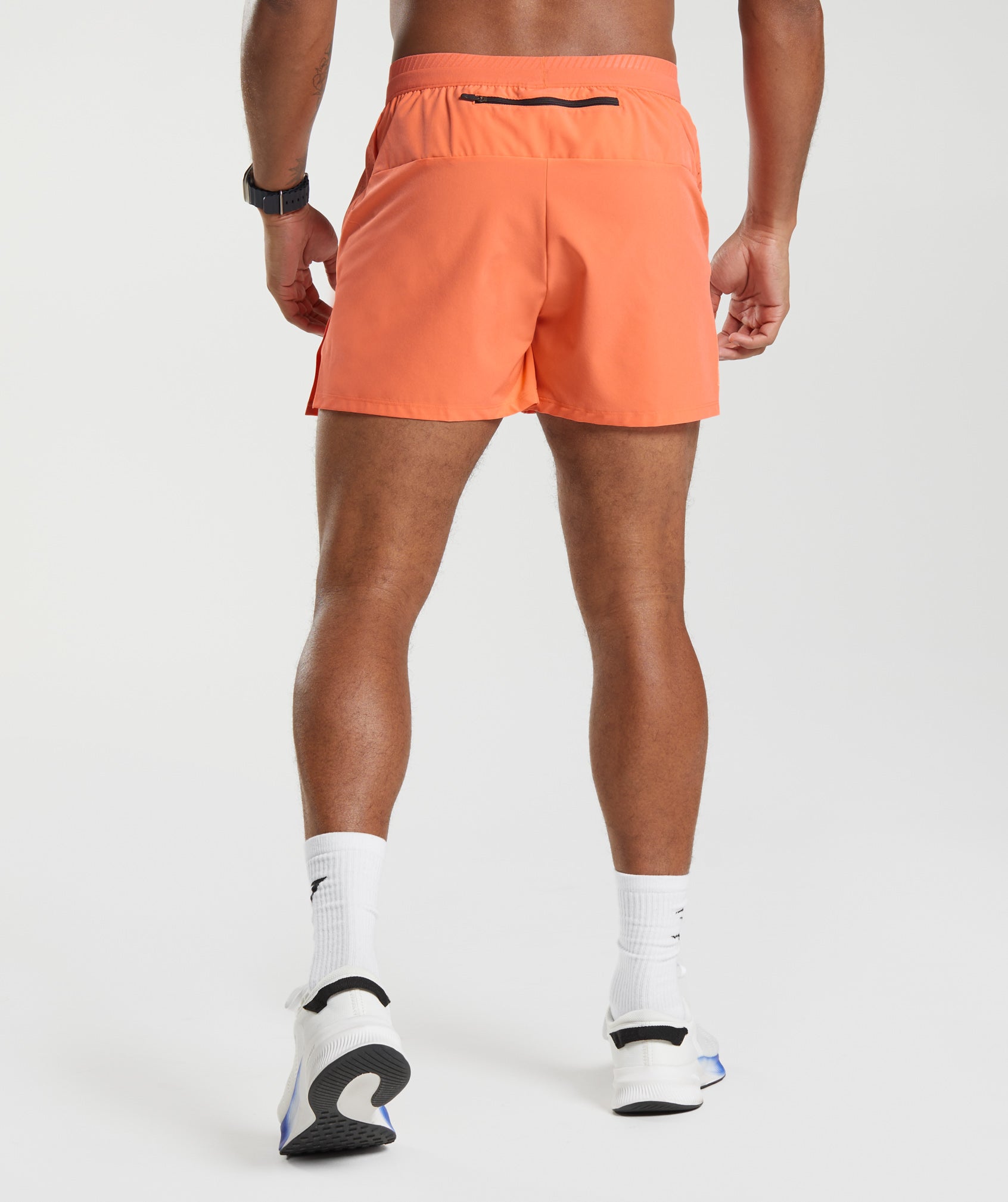 Apex Run 4" Shorts in Solstice Orange - view 2