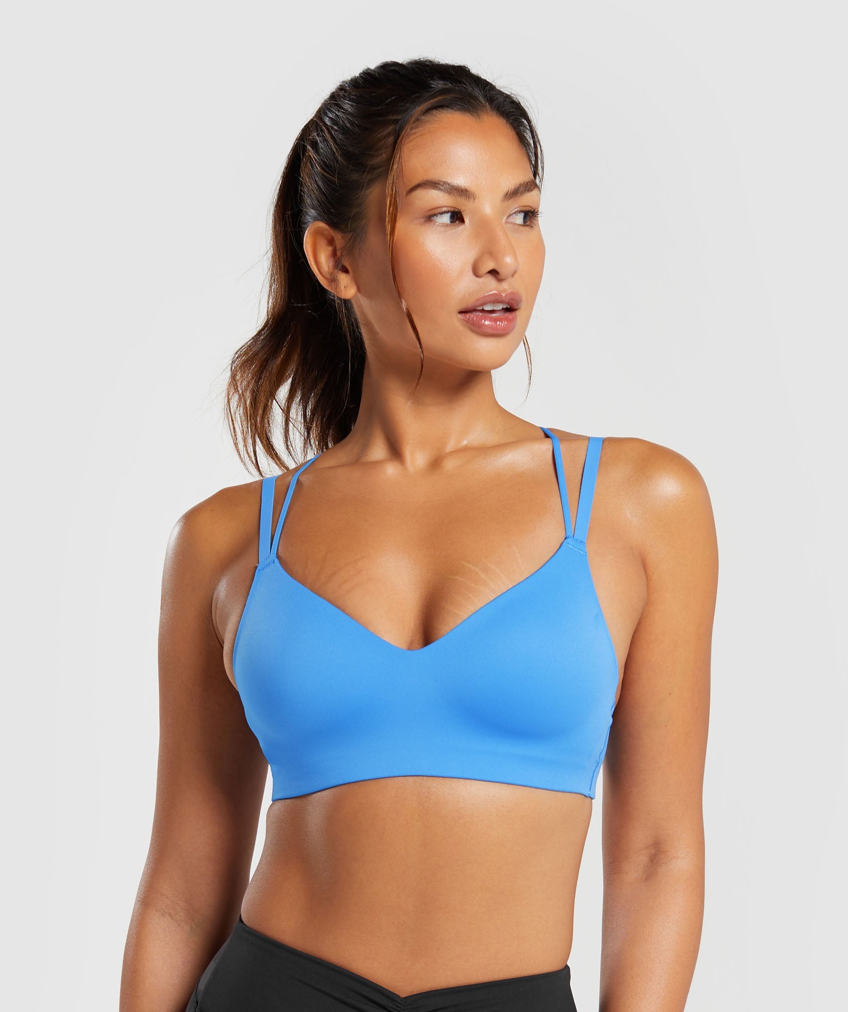 Strappy Back Light Support Sports Bra in {{variantColor} is out of stock