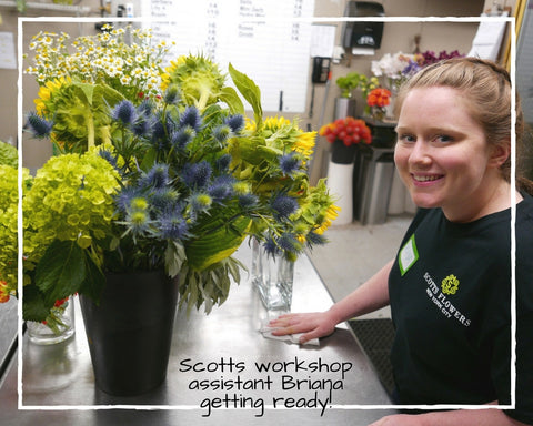 Scotts Flowers NYC Flower Workshop Assistant Wiping Table