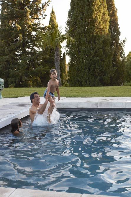 Playing in the pool with Frederic Fekkai and his kids Phillip and Cecilia