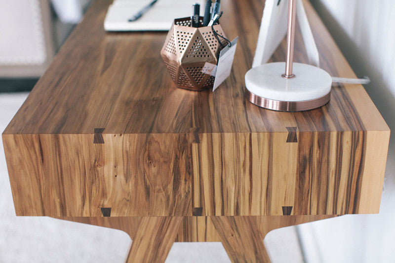 Waterfall edge of custom desk with dovetails and sweetgum wood 