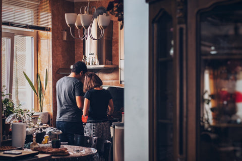 Two people cooking in a kitchen