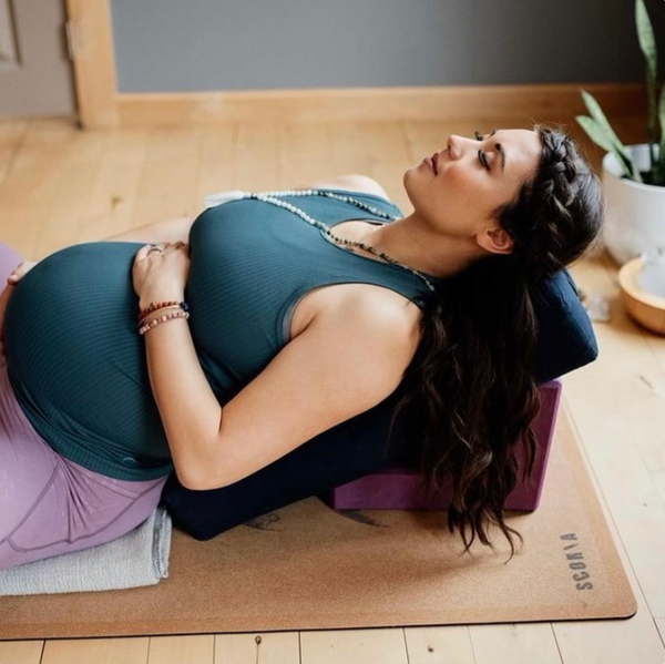 Pregnant woman on Scoria cork yoga Mat