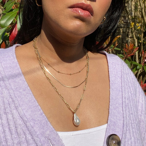 Layered gold necklaces
