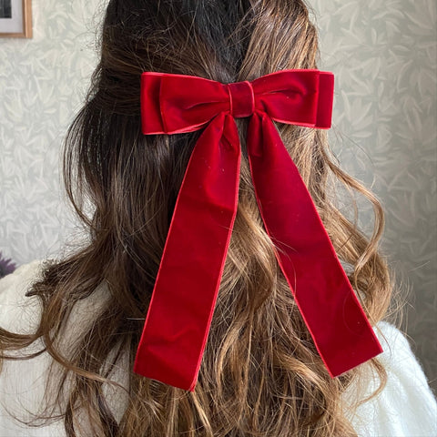 Red bow at the back of womans hair