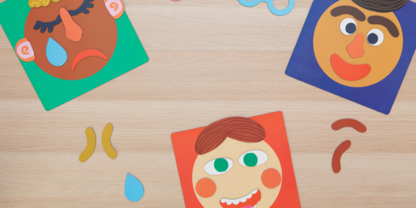 The Making Faces emotional learning magnetic play set is laid upon a flat surface. Depicting a variety of different facial expressions - happy, sad and uncertain.