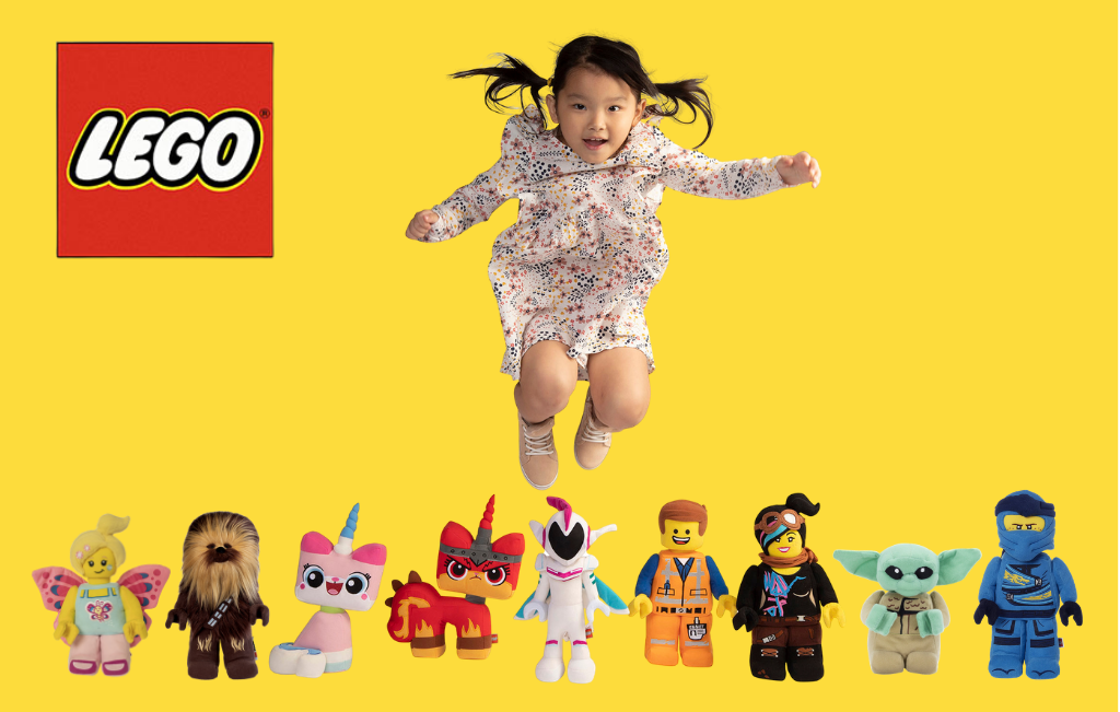 Girl jumping over LEGO minifigure plush characters. 