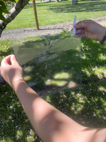 Insert provided wire hangers into trap holes.