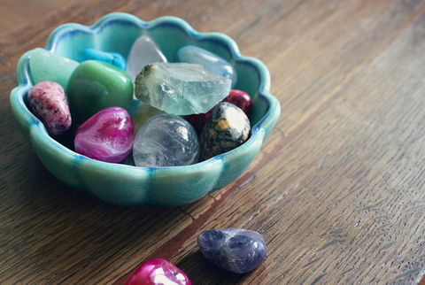 healing crystals in an aquamarine bowl