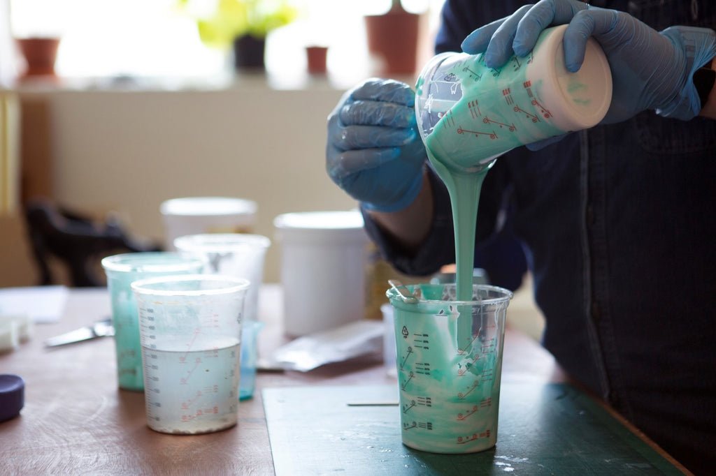 Beta Design Office pouring silicone to flip-flop mold made with the Mayku Multiplier pressure forming machine