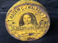 Vintage bottle of Madam C.J. Walker's hair growth pomade, a pioneering product in African American hair care, displayed against a neutral background.