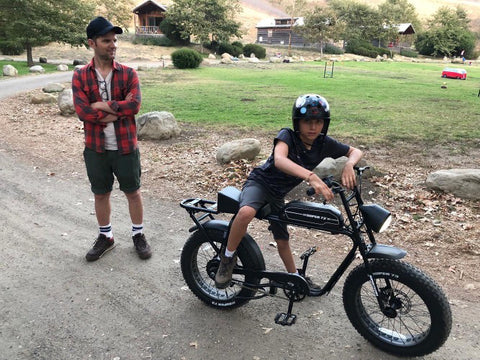 Photo of Adam Scott with his son on a SUPER73-S1 ebike.