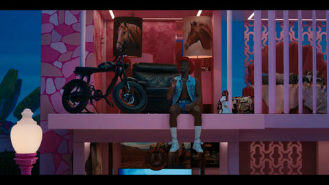 Image of Ncuti Gatwa as Ken in Barbie next to his SUPER73-S2 ebike.