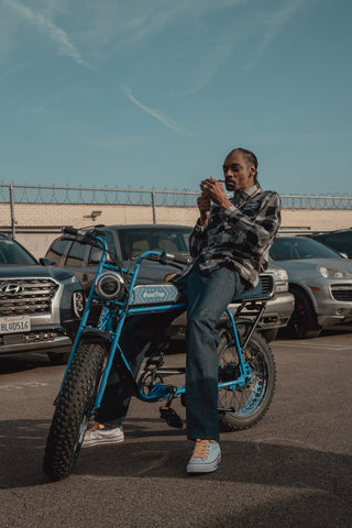 Photo of Snoop Dogg on his custom SUPER73-S1 ebike.