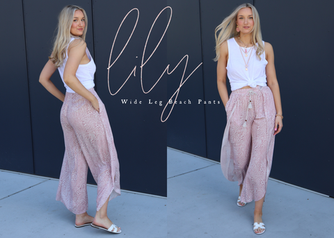 model in pink flowy pants and white tank top