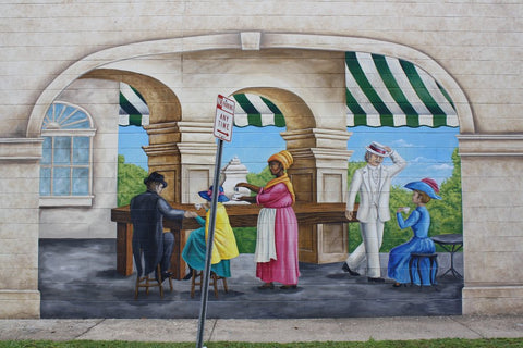 Mural by artist Max Bernardi depicting Rose Nicaud making coffee. Source: https://blacksouthernbelle.com/les-vendeuses-of-the-french-quarter-women-who-sold-food-for-freedom/