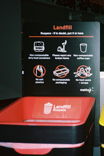 Method recycling bin in PwC Auckland office with custom signage.