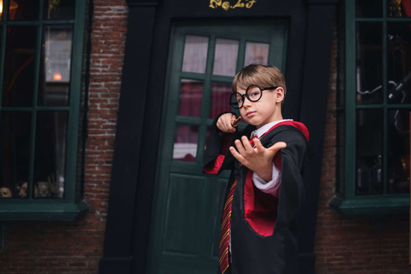 cosplay costume ideas, a boy dressed as Harry Potter for Comic Con