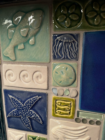 ocean themed handmade tile montage close up