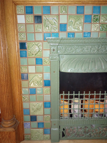 close up of blue and green handmade tile hearth