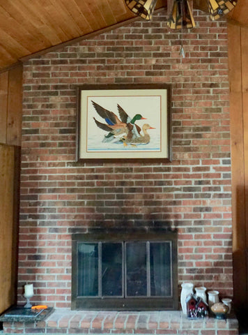 a brick fireplace before a renovation