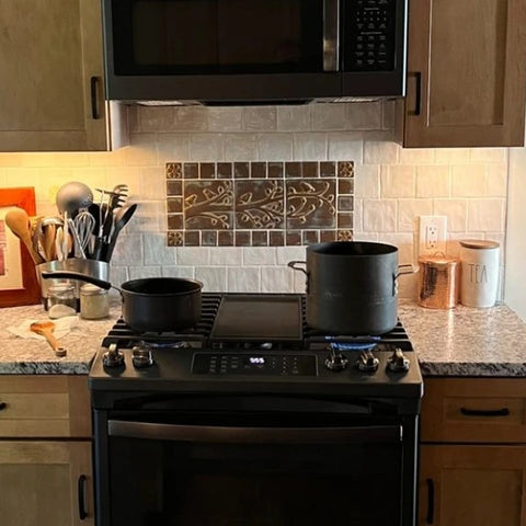 handmade tile set installed over a stove