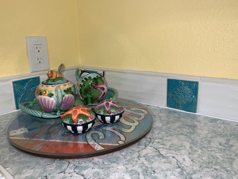 close up of corner of handmade tile installation over kitchen counter