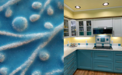 a sample of blue isle glaze on a ceramic tile next to a matching kitchen