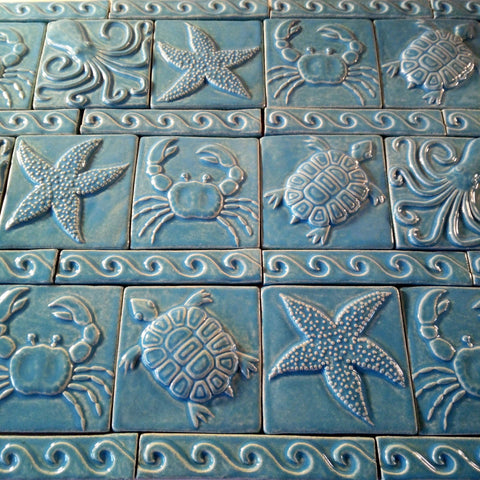 sea creature handmade tiles with waves in blue glaze