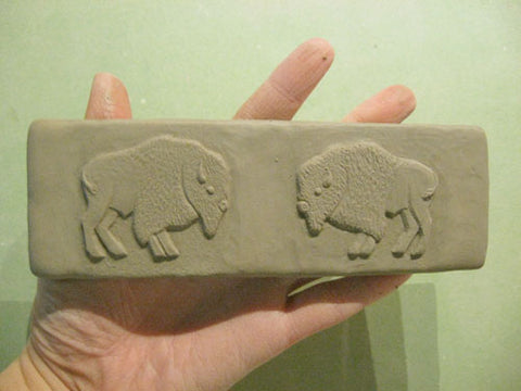 handmade tile featuring a pair of buffalos