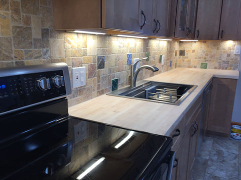 kitchen backsplash featuring multicolored handmade tile