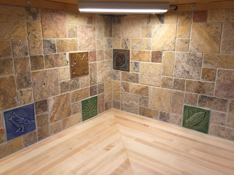 kitchen backsplash featuring multicolored handmade tiles
