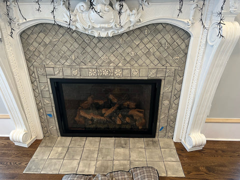 handmade tiles, set around a fireplace, awaiting grout